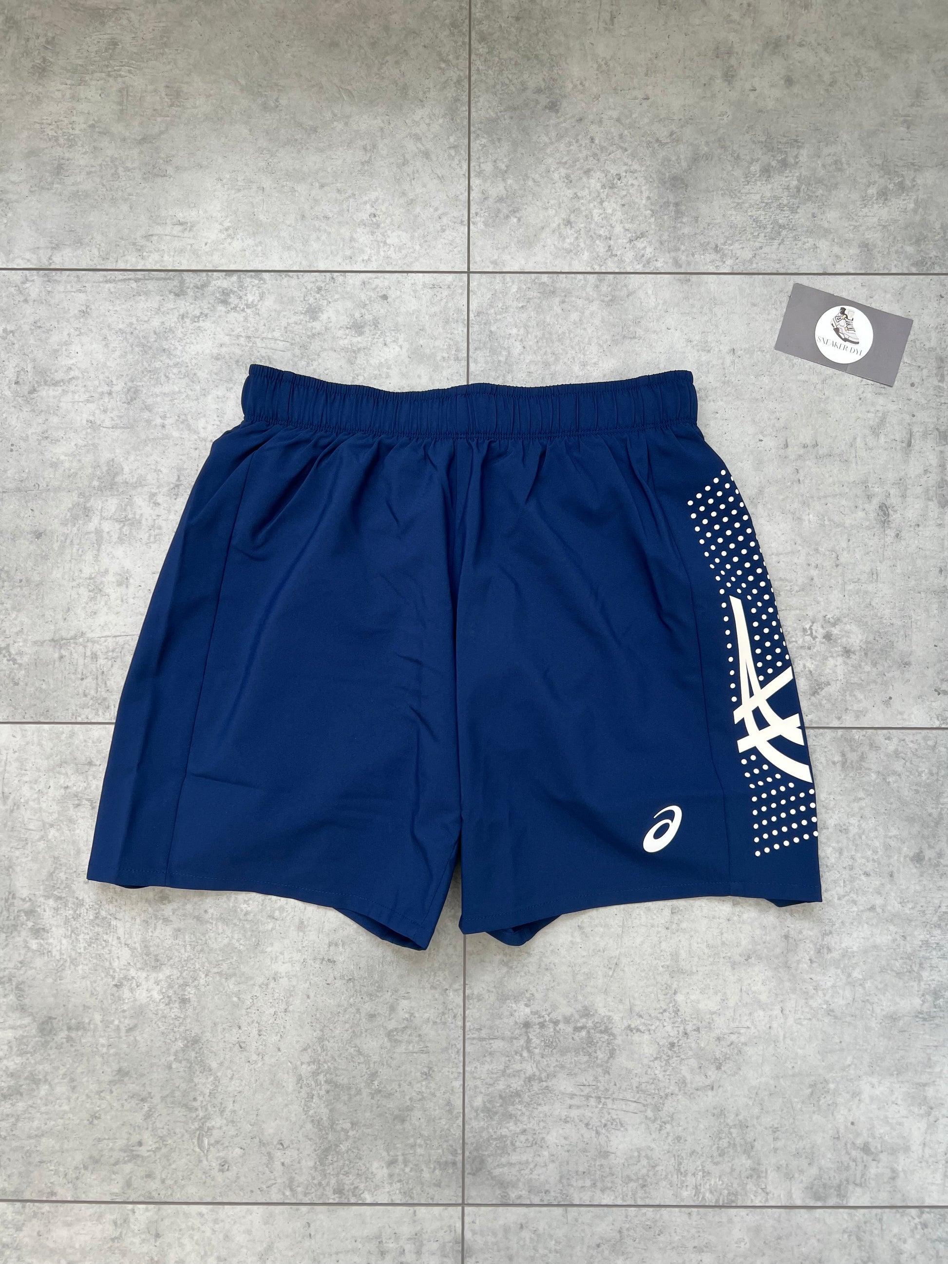 ASICS ‘Midnight Navy’ Icon Shorts featuring white logo branding and dotted graphic detail on the side panel.
