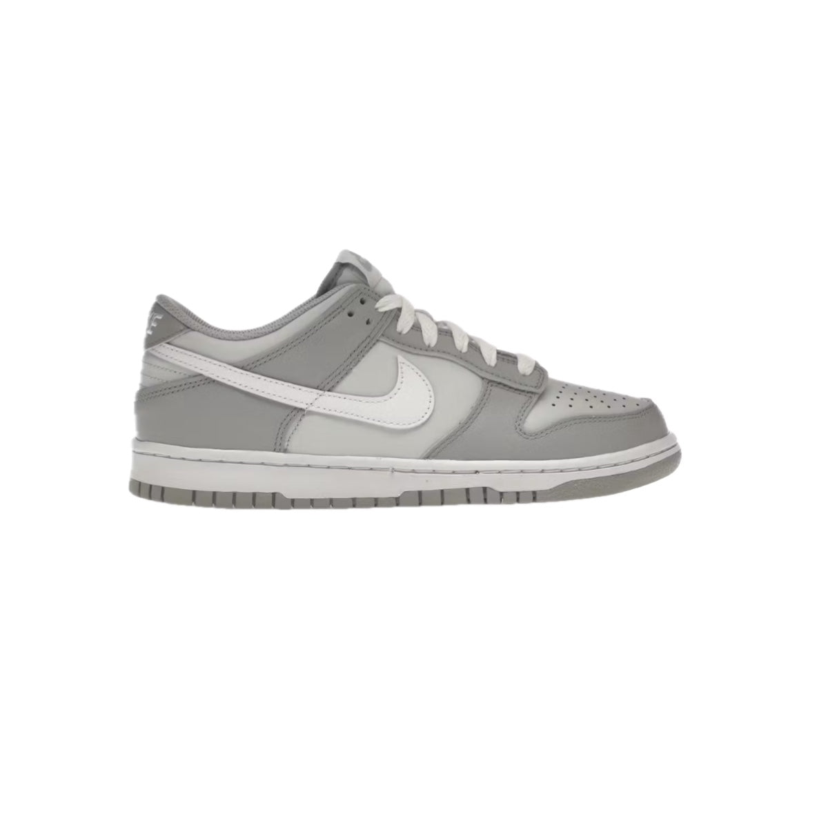 Side view of Nike Dunk Low GS ‘Two-Toned Grey’ featuring light and dark grey leather overlays with white swoosh and midsole, displayed on a white background.
